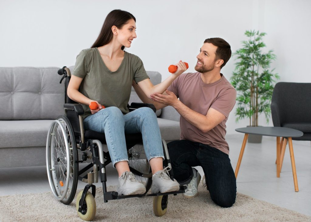 A man in a wheel chair being pushed by a woman